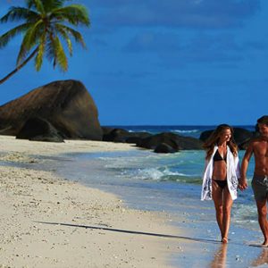 Hilton Seychelles Labriz Luxury Seychelles Holiday Packages Hilton Seychelles Labriz Resort And Spa Couple Romantic Stroll On Beach