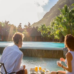 luxury Mauritius holiday Packages Dinarobin Beachcomber Golf Resort & Spa Couple On Honeymoon By Pool