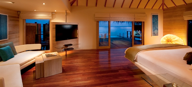 conrad maldives - premier water villa lounge and room