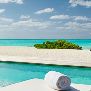 parrot cay by como - turqs and caicos lucury holidays - pool view of beach