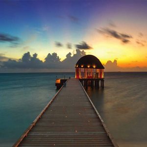 Ozen By Atmosphere At Maadhoo Island Luxury Maldives Honeymoon Packages Ozen Arrival Pavillion At Sunset