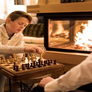 Pine Lodge Dolomites - Luxury Italy Holiday Packages - Playing chess