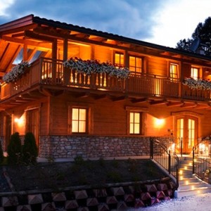 Pine Lodge Dolomites - Luxury Italy Holiday Packages - hotel exterior at night