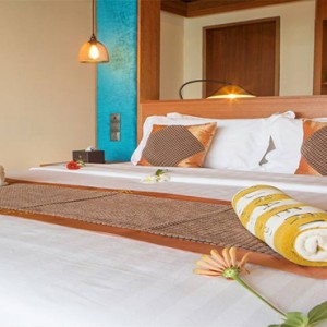 Furaveri Island Resort - Luxury Maldives Holiday Packages - water villa bed1