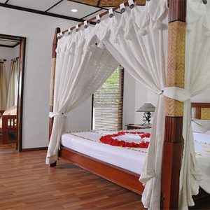 Bandos Maldives Luxury Maldives holiday Packages Deluxe Room Bedroom1