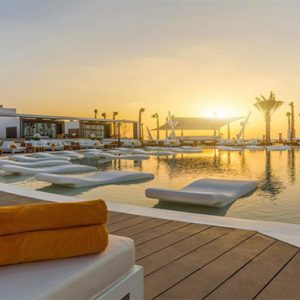 Nikki Beach Resort And Spa Luxury Dubai Honeymoon Packages Pool At Sunset