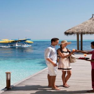 Vilamendhoo Island Resort And Spa Luxury Maldives holiday Packages Welcome On The Jetty
