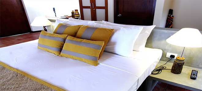 Cinnamon Wild Yala luxury Sri Lanka holiday Packages Jungle Chalet Pillows On Bed