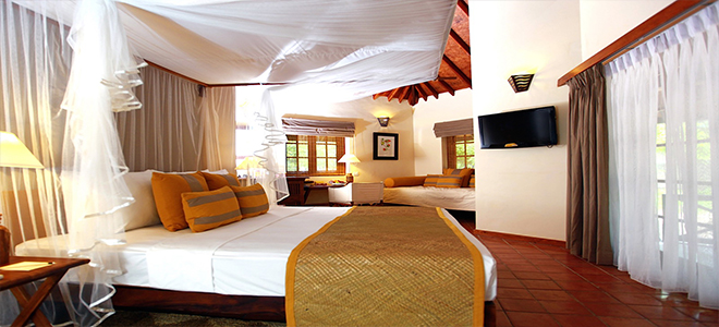 Cinnamon Wild Yala luxury luxury Sri Lanka holiday Packages Jungle Chalet Side View Of Bed