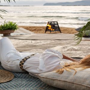 Luxury Greece Holiday Packages Domes Noruz Chania Woman Relaxing On Beach