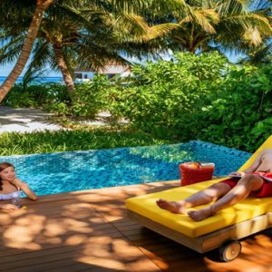 Luxury Maldives Holiday Packages Mercure Maldives Kooddoo Resort Couple Relaxing By The Pool