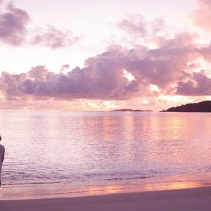 Maldives Honeymoon Packages Raffles Maldives Meradhoo Couple On Beach At Sunset