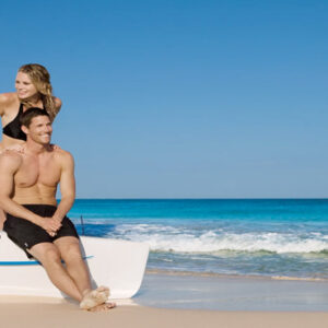 Luxury Mexico Holiday Packages Dream Jade Resort & Spa Couple On A Catamaran On The Beach