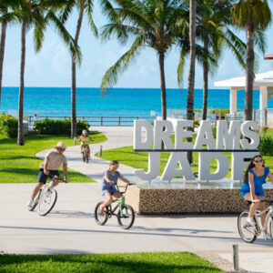 Luxury Mexico Holiday Packages Dream Jade Resort & Spa Family Riding Bikes