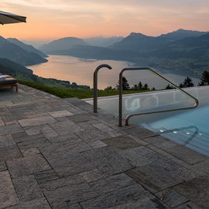 Luxury Switzerland Holiday Packages Hotel Villa Honegg Pool At Sunset