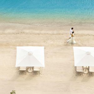 Couple Strolling On Beach Ikos Olivia Resort Greece Holidays